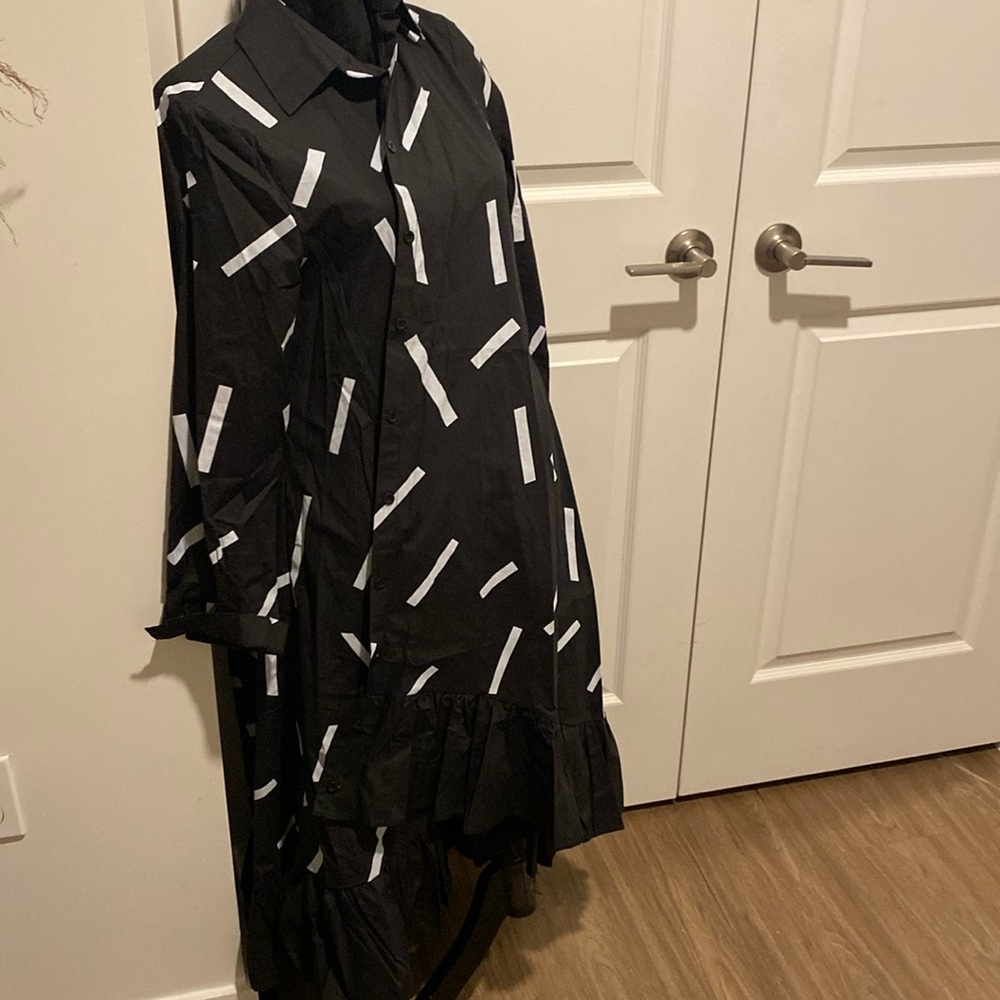 Oversized dress shirt- can be worn open or belted. Looks great with boots.